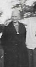 A black and white photo of a person walking by a fence

AI-generated content may be incorrect.
